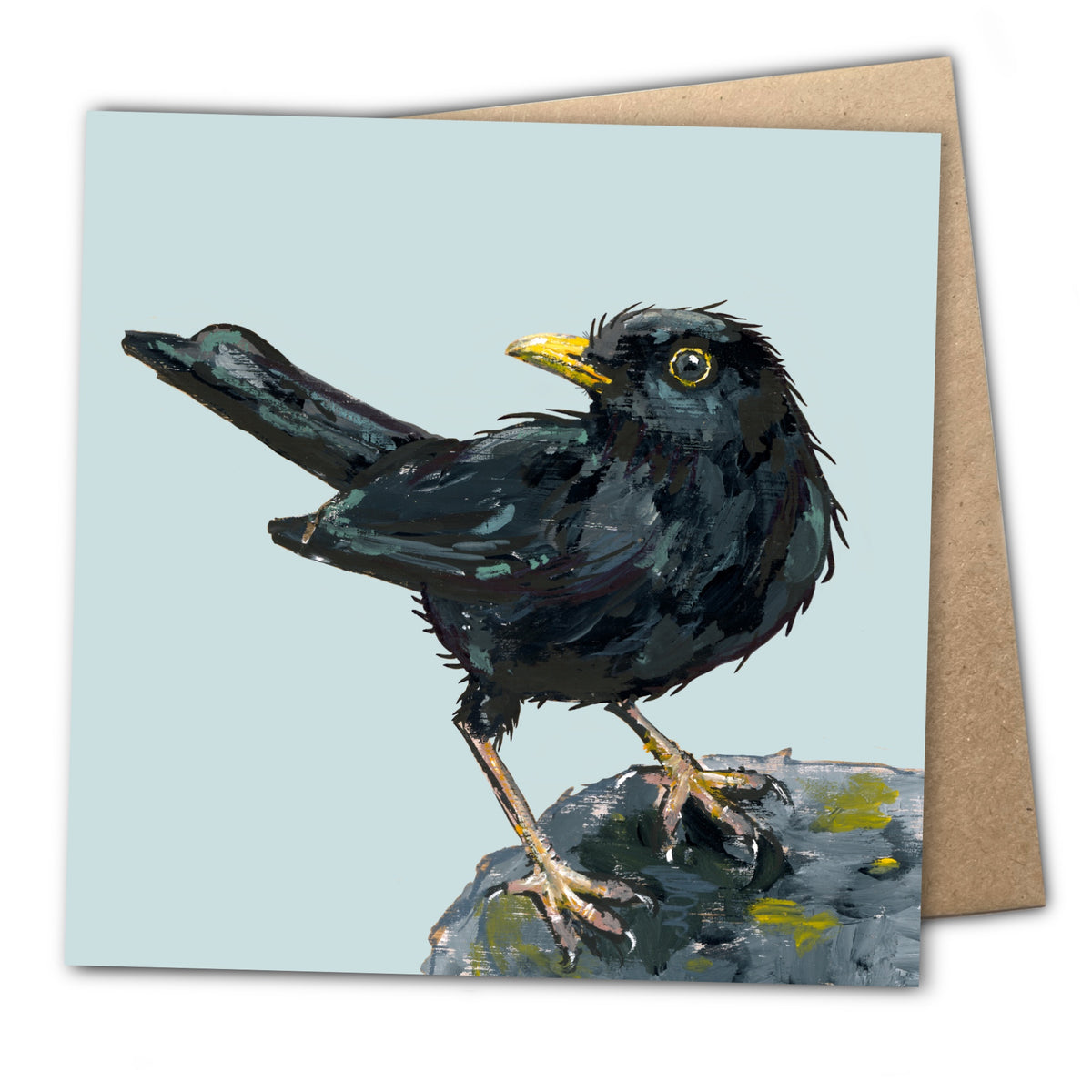 Front of a square greetings card by Ellwood Parker featuring a painted blackbird illustration with a gold beak. The card is displayed its brown paper envelope.