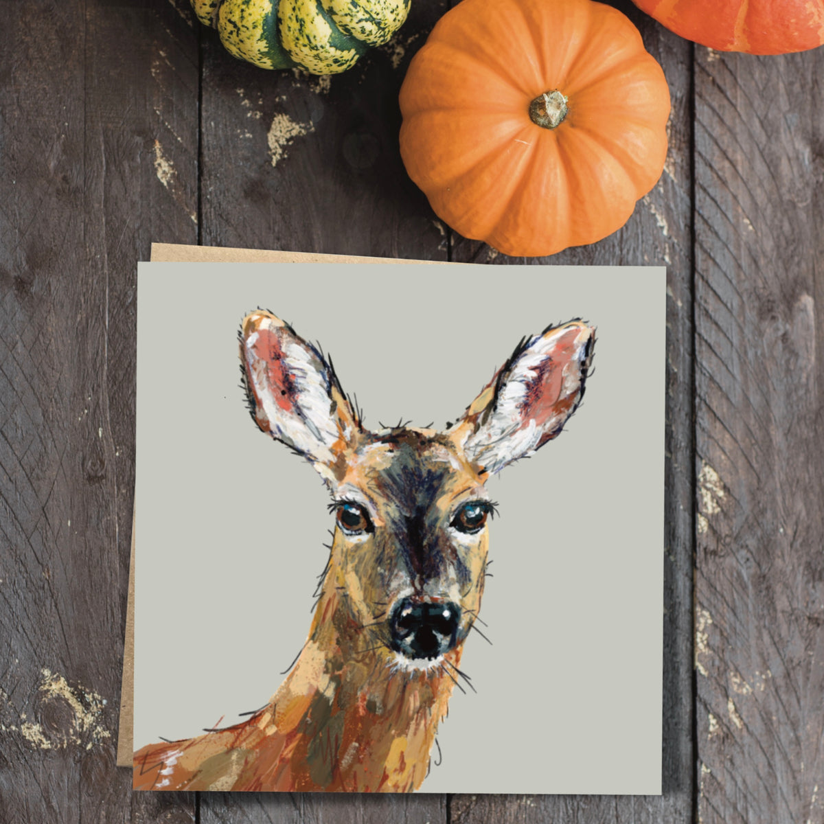 Dinky the Deer, a British woodland mammal, this illustrated card is shown with its 100 percent recycled brown kraft paper envelope.