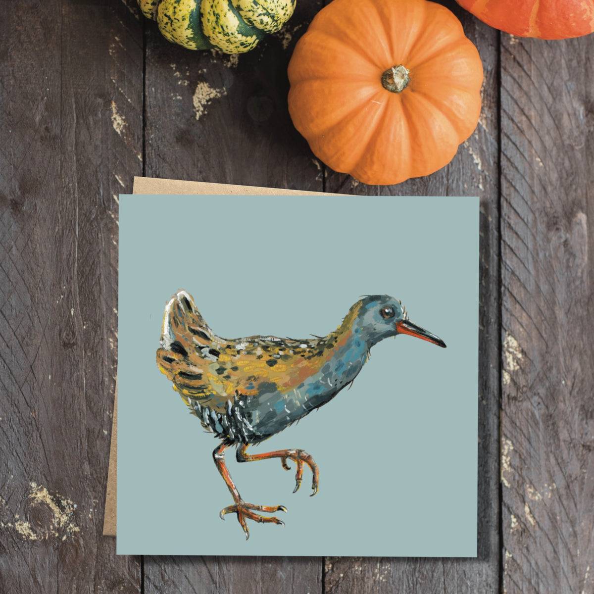 Square egret illustrated art card shown alongside its 100 percent recycled brown kraft paper envelope.