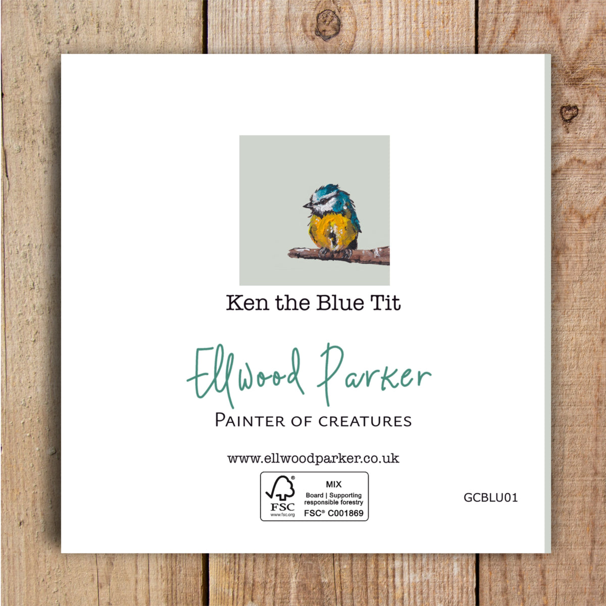 Ken the Blue Tit, an cute but energetic and colourful garden bird depicted in a characterful wildlife painting on a plastic-free greetings card. The back of the card is shown.