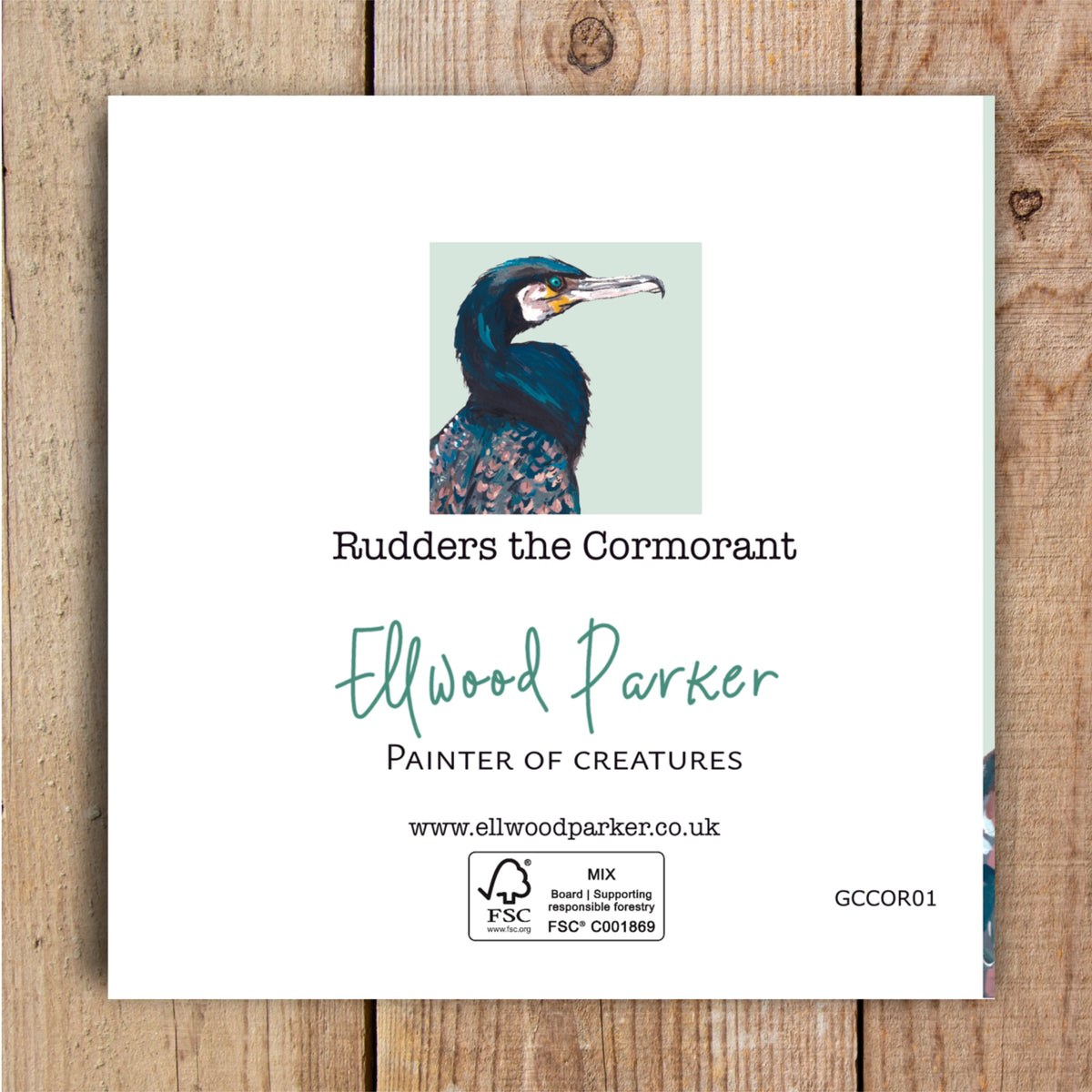 Back of a blank wildlife greeting card of a cormorant featuring the artist logo and eco-friendly certification details.
