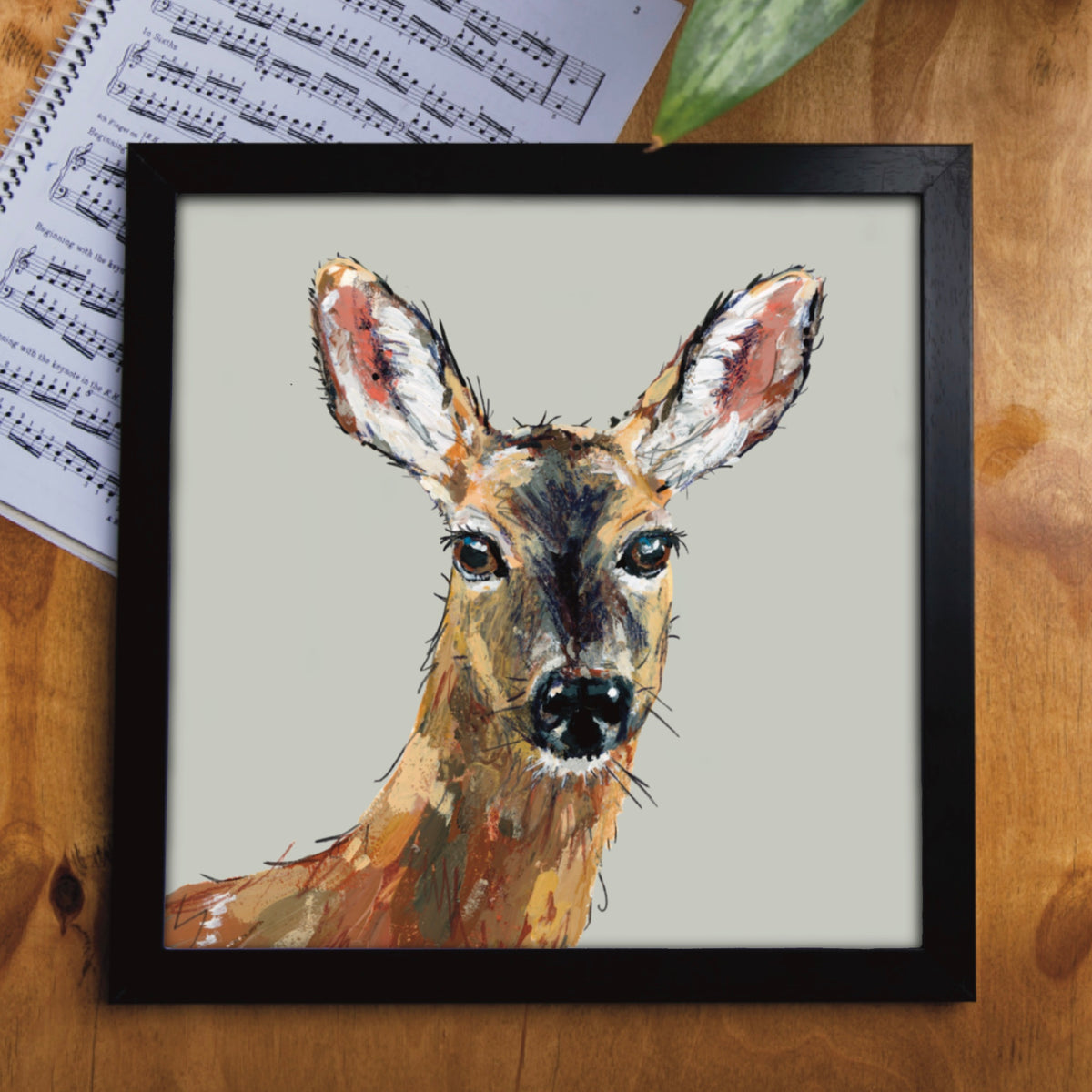 Ellwood Parkers Dinky the deer greetings card, which is framed in a black frame as a unique nature lover gift.